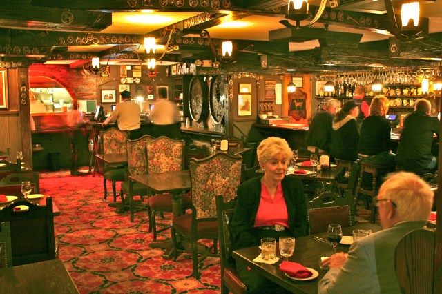 Original proprietors Mr. and Mrs. Fletcher in the foreground enjoy the Friday night salmon special.