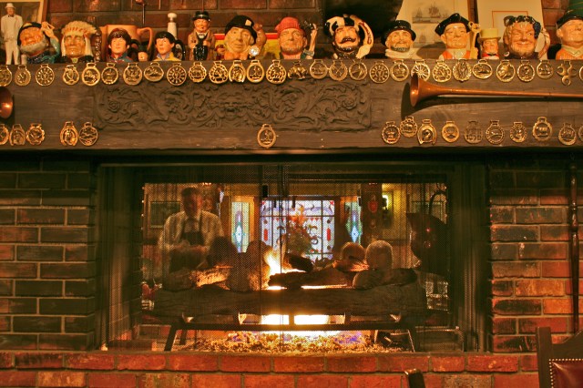 Cozy fireplace as room divider.  Lots of 